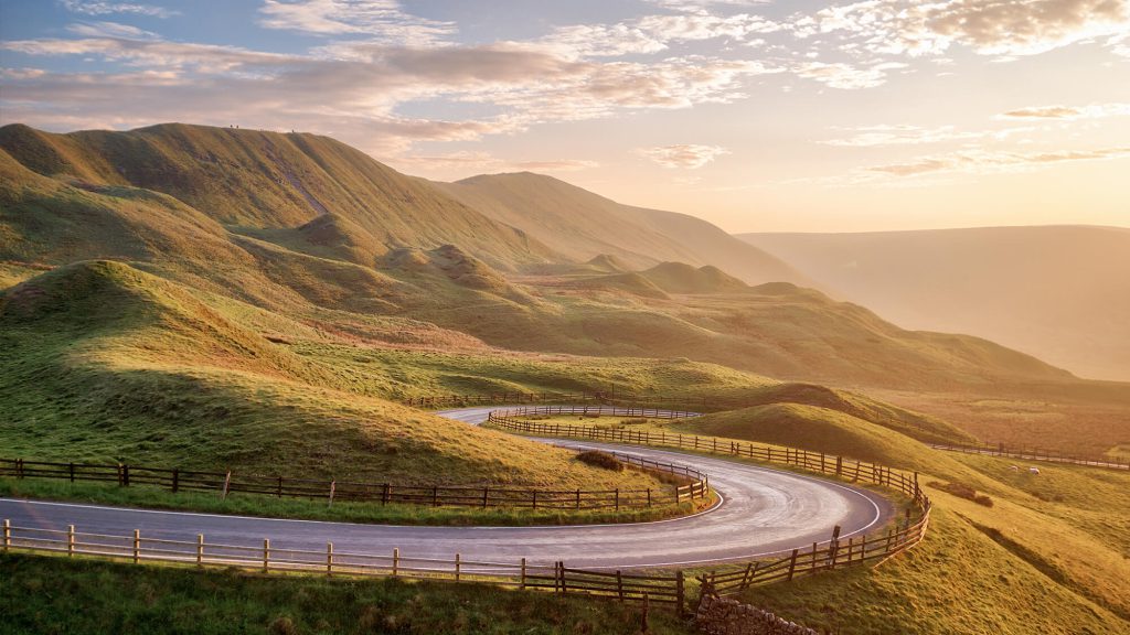 Scenic winding road in the Peak District, inspiration for campervan adventures in the UK