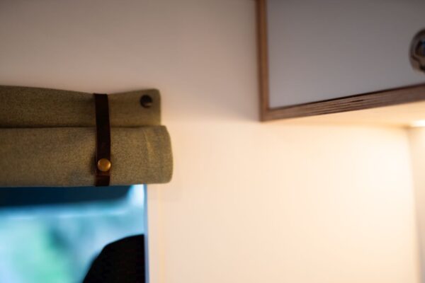 Drawer handle detail on birch plywood cabinetry inside a Bhode campervan